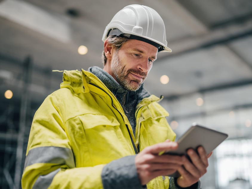 Dutchview_Dutch_construction_worker_in_a_bright_yellow_high-v_bf3f9f12-c412-4860-bf41-644cb6cda26c_0